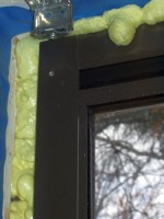 Window frame with spray foam